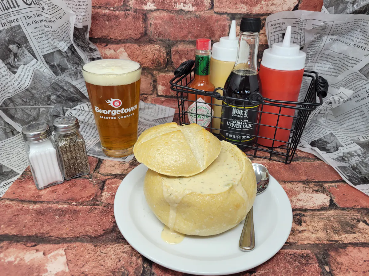 a breakfast sandwich and a cup of coffee